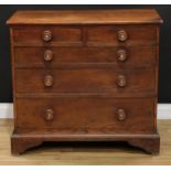 A 19th century oak chest, slightly oversailing rectangular top above two short and three long