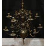 A Dutch brass two-tier twelve light chandelier, drilled for electricity, 67cm high