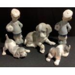 A large Lladro figure of a puppy, 15cm high; others; two Lladro figures of boy and football (5)
