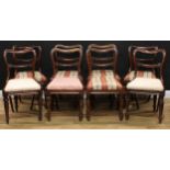 A set of eight William IV rosewood dining chairs, drop-in seats, lotus capped tapered cylindrical