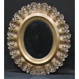 Interior Design - an oval wall mirror, the frame consisting of removalble coronet shaped pierced