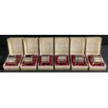 A set of six silver napkin rings, boxed, Birmingham 1974, 267g