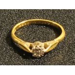 An 18ct gold illusion set diamond solitaire ring, platinum bezel, ring size L, 1.92g