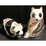 A Royal Crown Derby paperweight, Panda, printed mark gold stopper; Baby Panda (2)