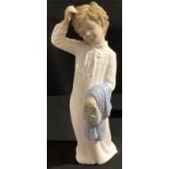 A Nao by Lladro figure, girl holding slippers, 27cm high