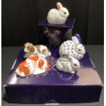A Royal Crown Derby paperweight, 25th Anniversary Rabbits, printed mark gold stopper, boxed,