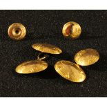 A pair of 15ct gold oval engraved cuff links, marked 625, 7.2g; a 9ct gold collar stud, another, 1.