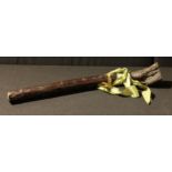 An Irish root Schillelagh, tied with a green ribbon, 43cm