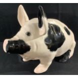 A Griselda Hill Wemyss ware pottery pig, seated, black markings, 31cm high, painted marks