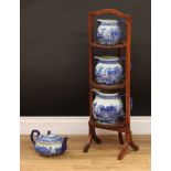 An Edwardian oak three tier cake stand; a set of Chinese Staffordshire reproduction graduated jugs