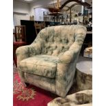 A Brecon button back armchair, upholstered in multitone abstract pattern fabric, turned legs, castor