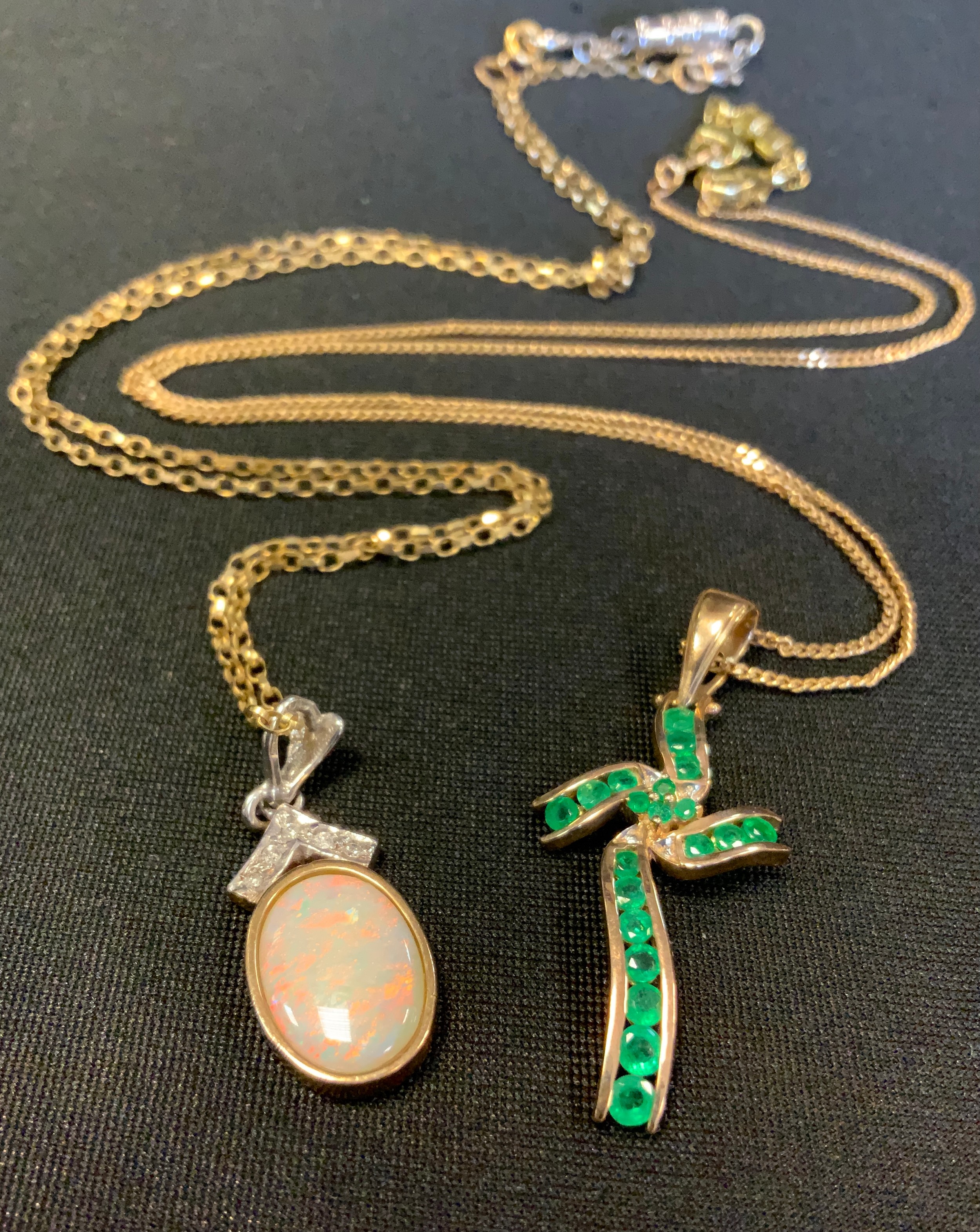 An emerald and diamond stylized cross pendant necklace, 5.2g gross; an opal and diamond accented