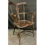 An early Victorian oak and beech elbow chair, lyre shaped back splat, turned and spirally fluted