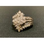 A multi-layer diamond cluster ring, 14ct white gold shank, size Q/R, Birmingham import marks, 10.