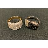 A modern design black and white diamond stepped platform dress ring, 9ct white gold shank, size