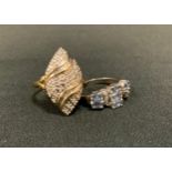 A 9ct gold diamond panel ring, arched marquise crest, pave set with round brilliant and baguette cut