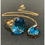 A synthetic vibrant blue stone diamond accented dress ring, 9ct gold shank, size R; a similar
