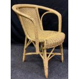 A Late 19th/early 20th century wicker work arm chair.