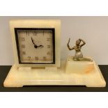 An Art Deco marble figural timepiece, the square clock with Arabic numerals, the rectangular base