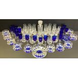 Glassware - a set of eleven blue glass wine glasses; a cut glass decanter, whiskey cups; dessert