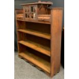 An Oak, Arts and Crafts bookcase cabinet. Having a small, glazed door cabinet section , flanked by a