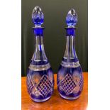 A pair of Bohemian blue flash decanters