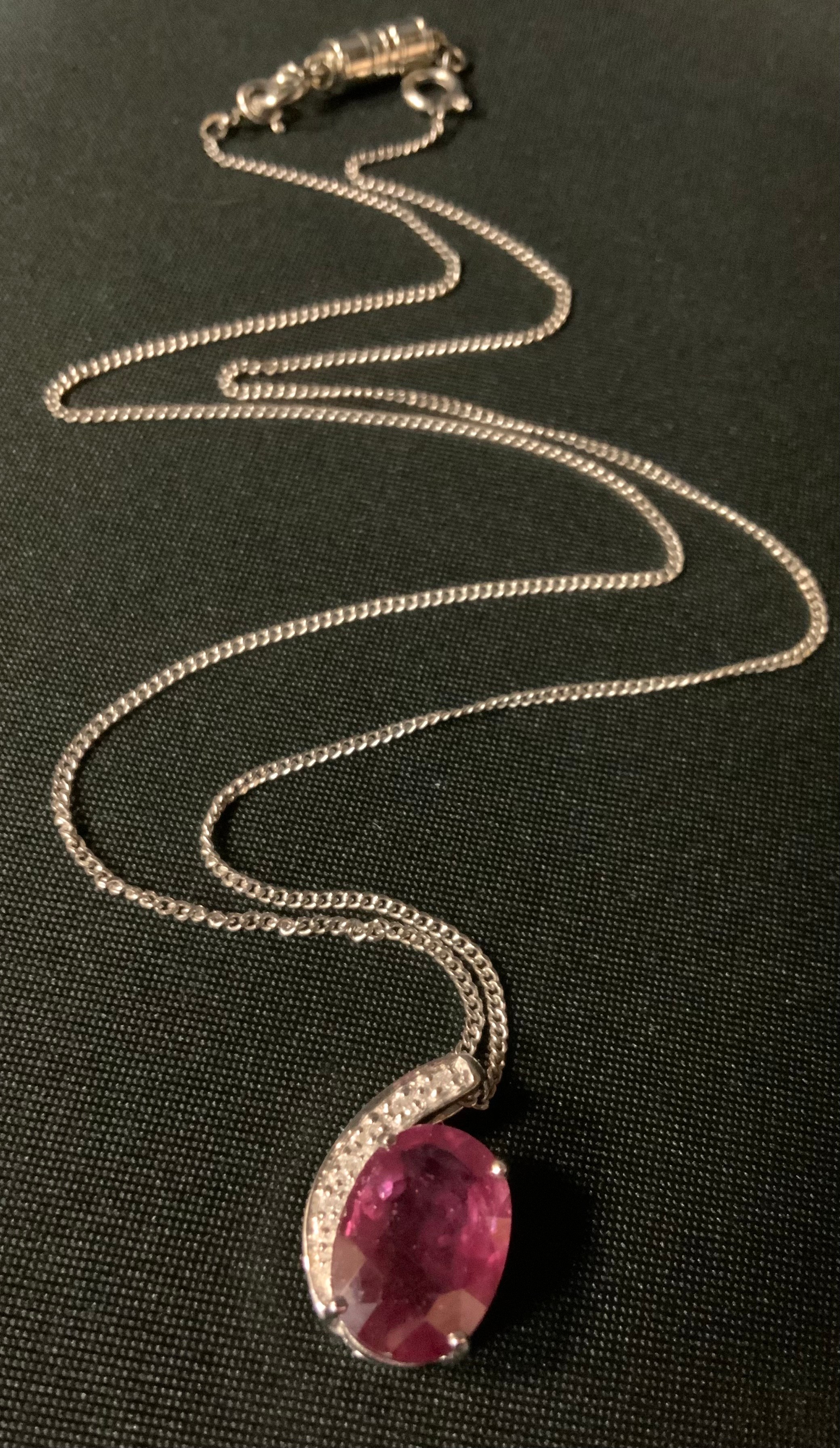 A Diamond and pale red ruby pendant necklace, 18ct white gold mount and chain, stamped 750, 8.5g