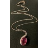 A Diamond and pale red ruby pendant necklace, 18ct white gold mount and chain, stamped 750, 8.5g