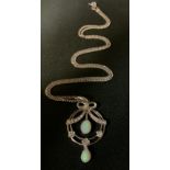 An Edwardian style opal and diamond ribbon swag pendant necklace, 9ct white gold mount and chain,