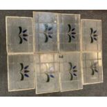 Eight stained glass window panes, each with stylised flower, 30cm x 49cm