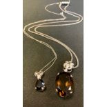 A smoky quartz and diamond oval pendant necklace, 9ct white gold mount and chain, 11.9g gross; a