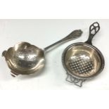 An Art Deco style silver tea strainer, E Viner, Sheffield 1960; another, Elkington & Co,