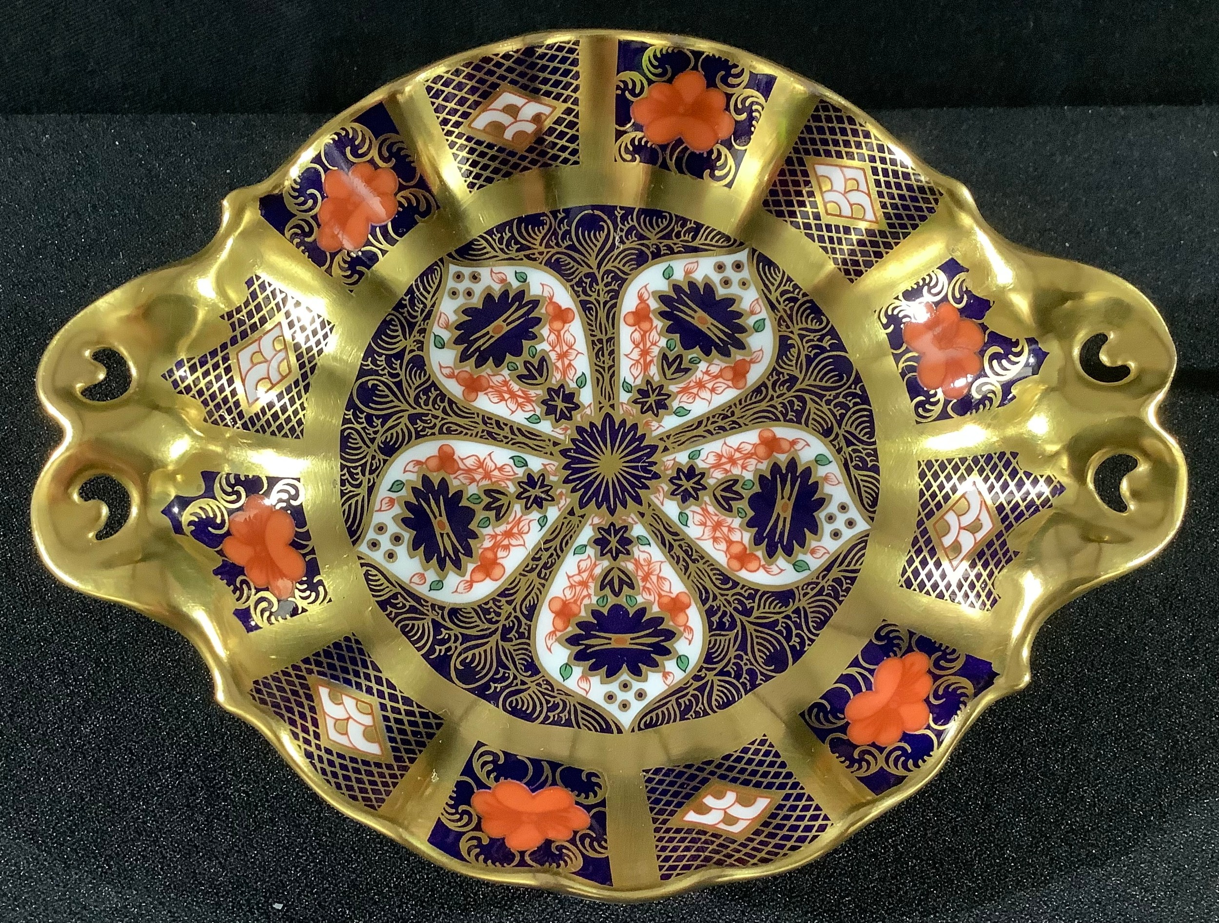 A Royal Crown Derby Imari 1128 pattern two handled pedestal bon-bon dish, solid gold band, 16cm