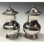 A pair of Elizabeth II silver salt and pepper pots, Birmingham 1977, 6oz