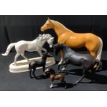 A Beswick Palomino horse, large; a Royal Doulton, Black Beauty; a Beswick black foal; a Royal