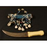 Tribal Art - a Sudanese Islamic dagger, the curved blade with Arabic script, bone handle, beadwork
