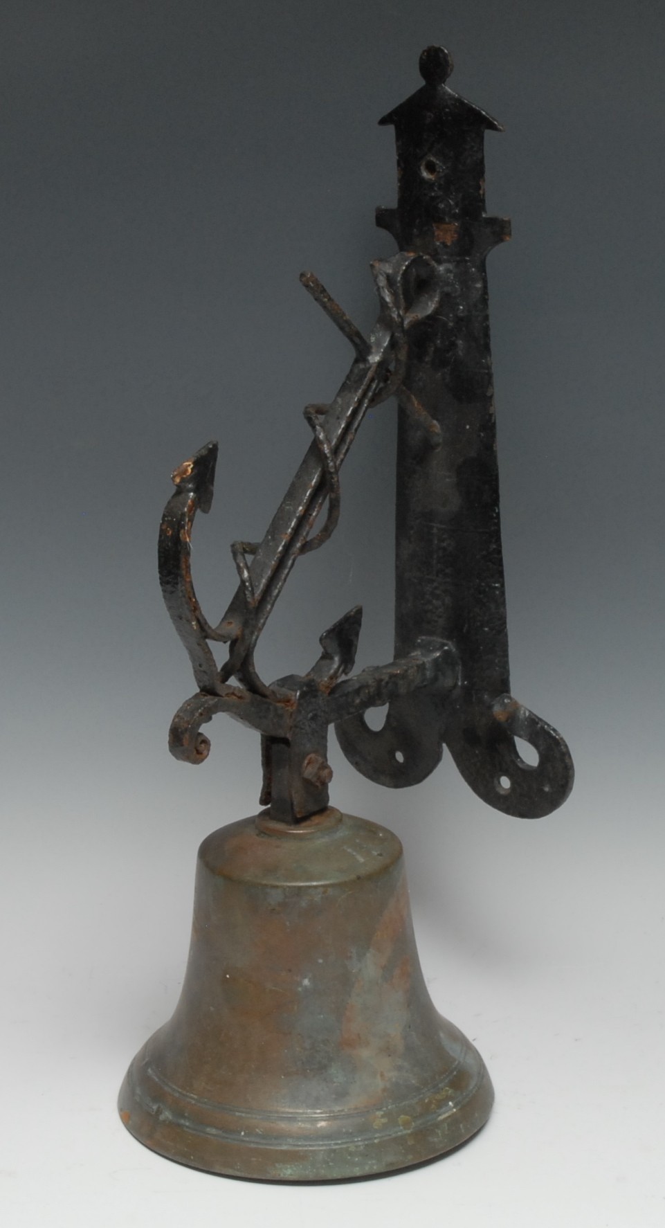 An early 20th century bronze bell, the wrought iron nautical wall bracket with fouled ship's anchor,