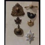 Badges - a Royal Canadian Mounted Police cap badge; others (7)