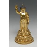 Sino-Tibetan School, a gilt bronze or copper alloy figure, the infant Buddha, he stands, upon a