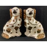 A pair of 19th century Staffordshire King Charles spaniel mantel dogs, copper lustre spots and