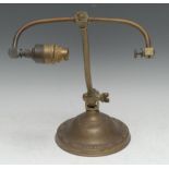 An early 20th century brass desk lamp, domed base with bead-and-reel border, 34cm high