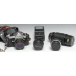 A Pentax ME Super 35mm SLR camera, Pentax-M f1.7 50mm lens, leather case; A Pentax-M f2.8 28mm lens;