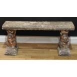 A reconstituted stone garden bench, the end supports cast as squirrels, 44cm high, 101cm wide,