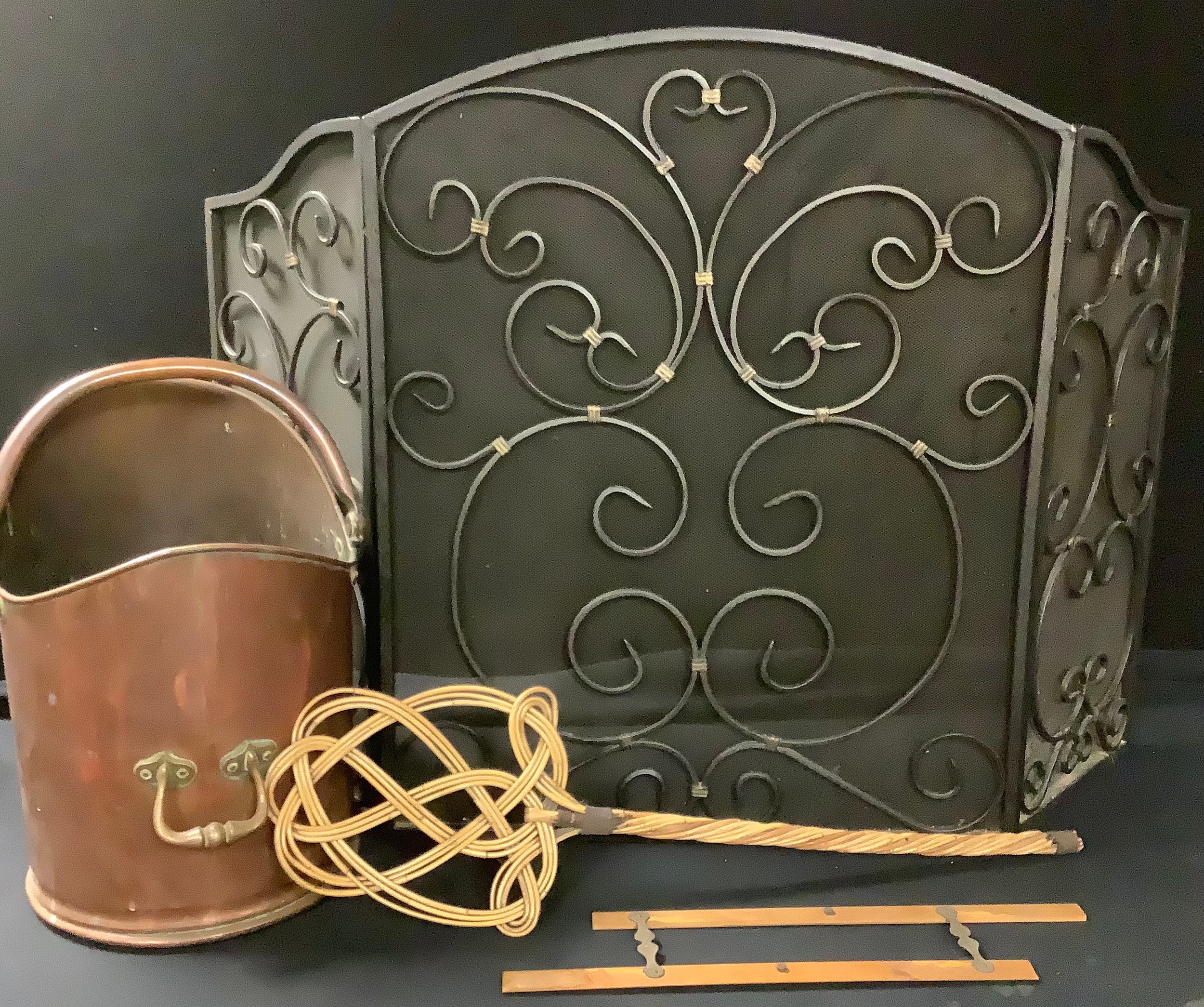 A copper coal scuttle; a black wrought iron fire screen; etc