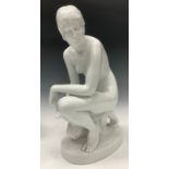 A Herend figure, nude female kneeling, signed in the maquette, white gloss glaze, number 5707, 35cm,
