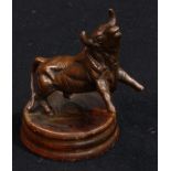 A brown patinated spelter toothpick holder, as a bull, probably Spanish, softwood base, 10cm high