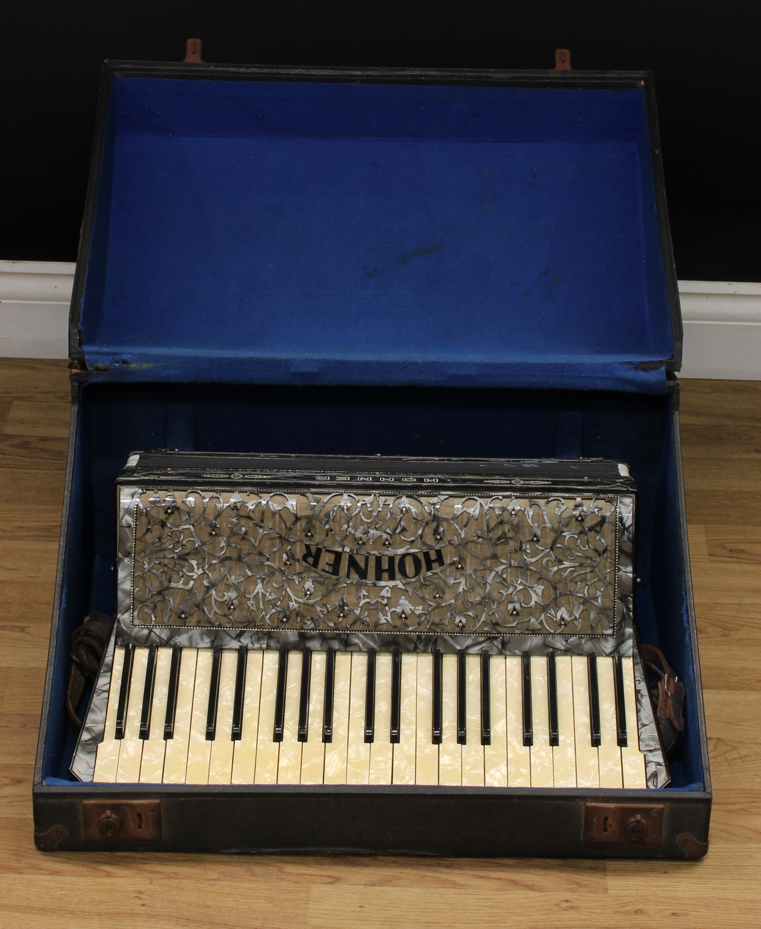 Musical instruments - a pre-war piano accordian, serial no. 213781, cased