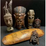 Tribal Art - an Indonesian bark carving as the head of a deity, wooden base, 44cm; an Austrailian