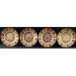 A Royal Crown Derby Imari 1128 pattern side plate, first quality; three others, second quality (4)