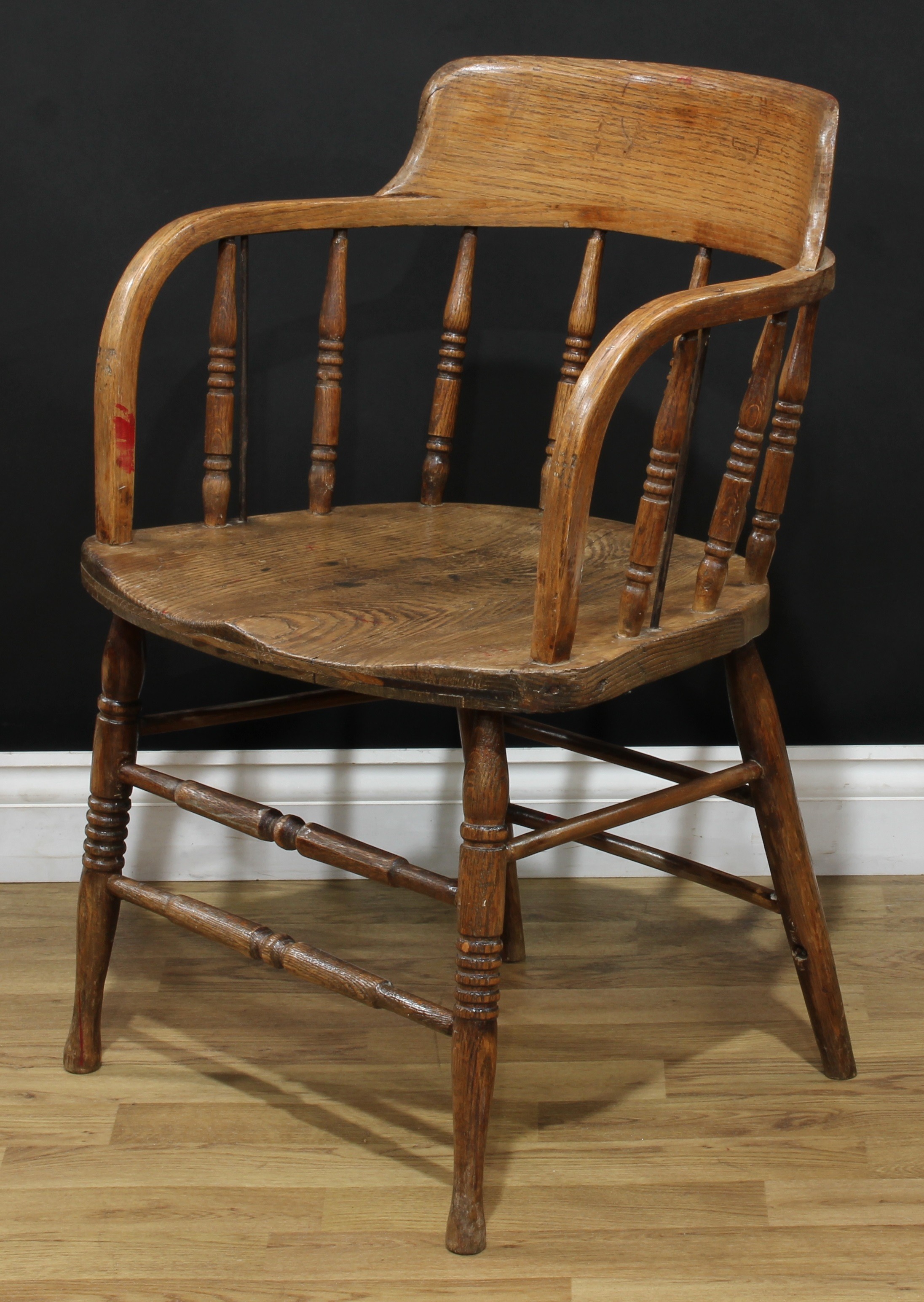 A 19th century elm desk chair, of Windsor construction, turned legs and spindles, 78cm high, 56cm